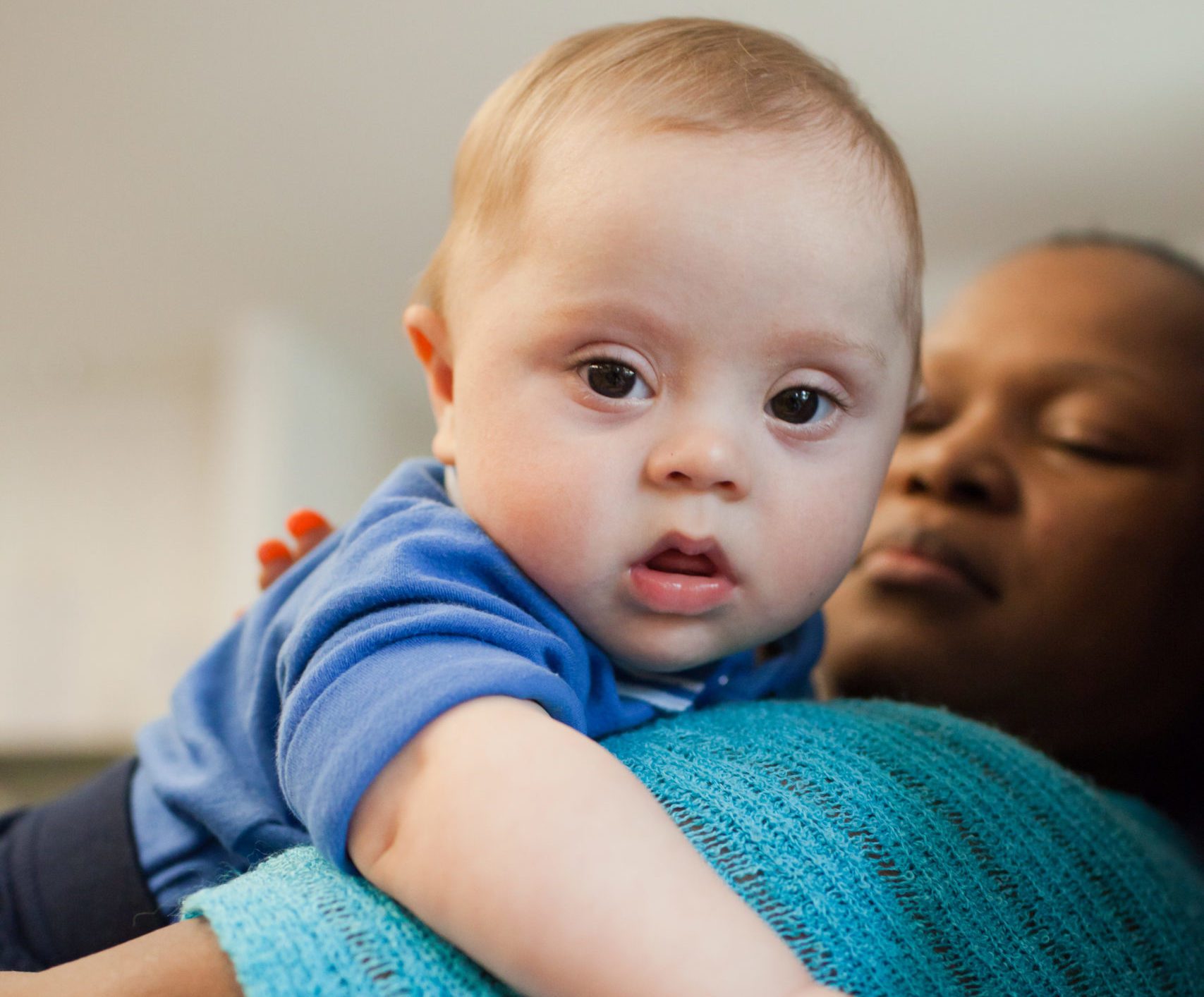 caregiver holding baby