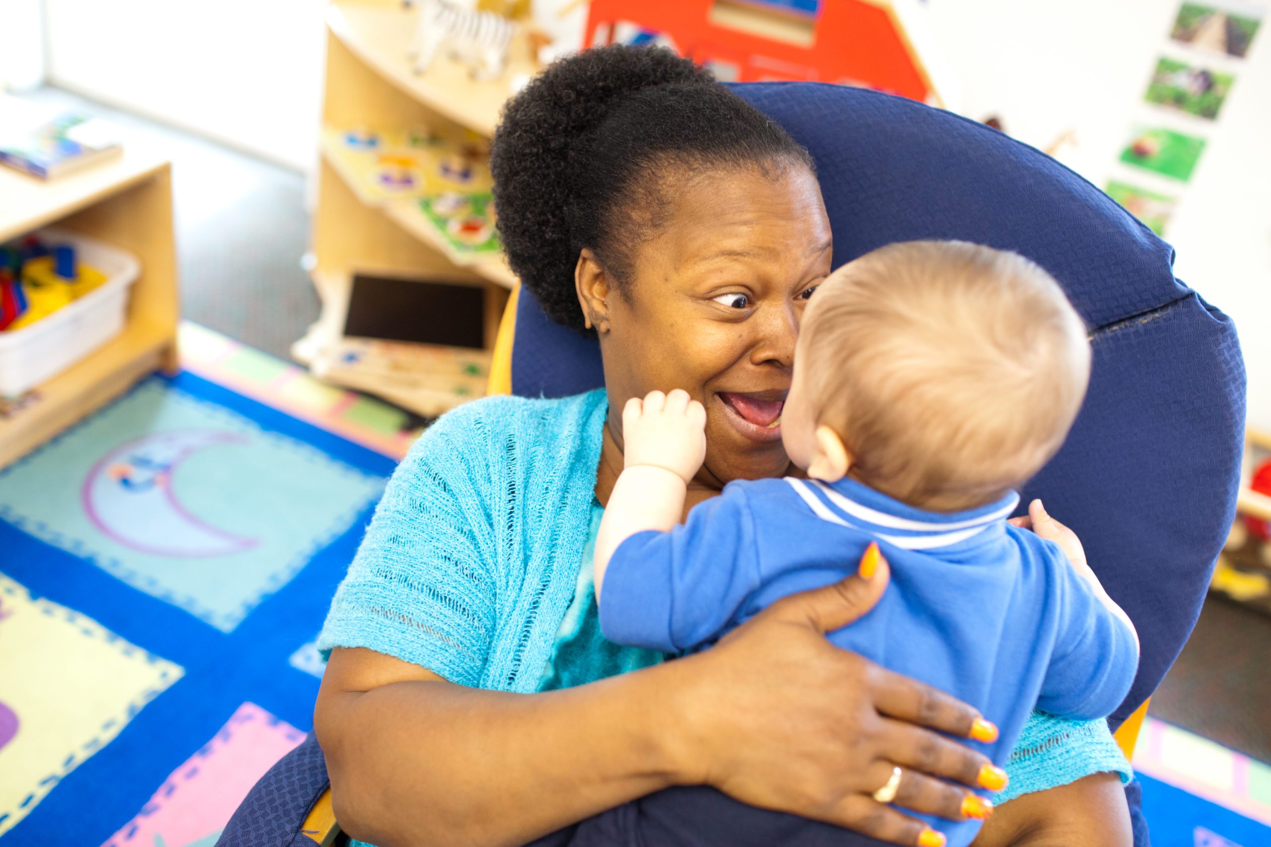childcare worker with baby